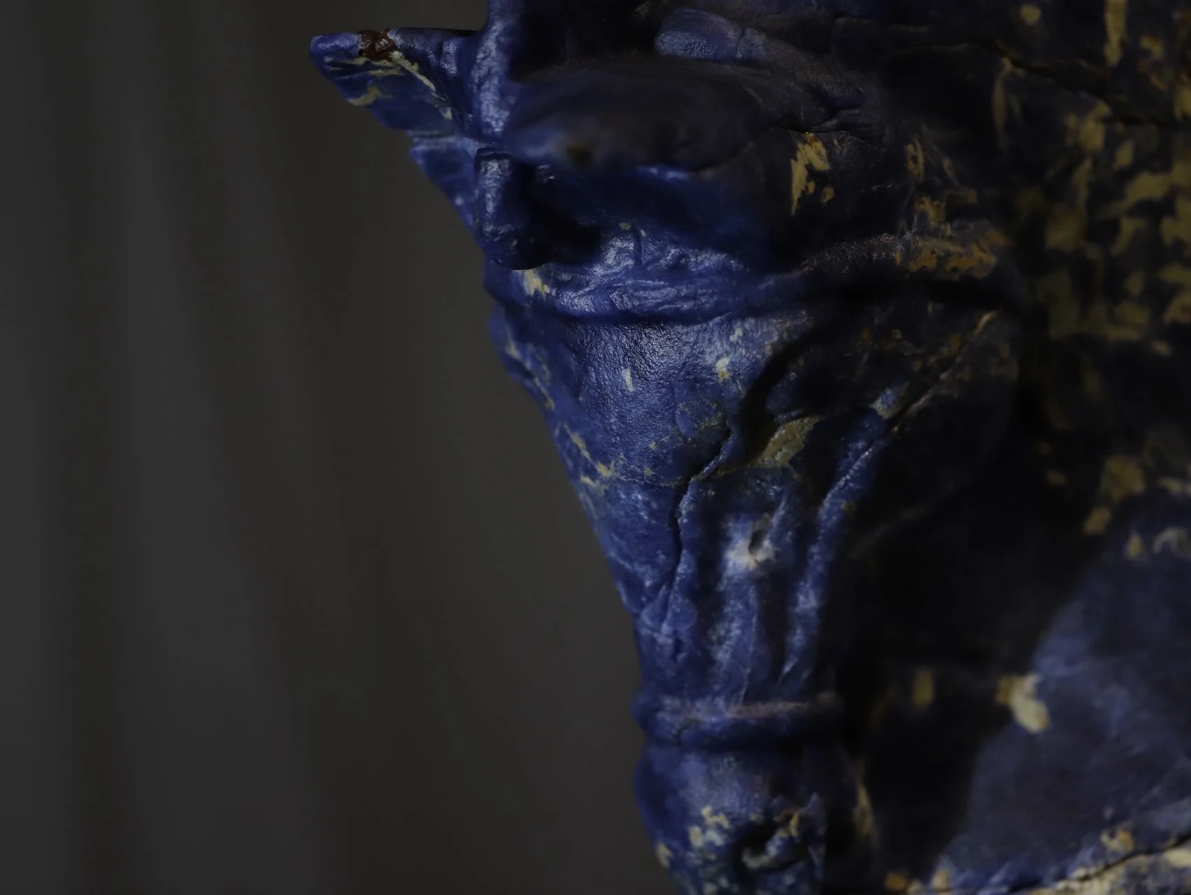 Close-up of the blue stone equine sculpture