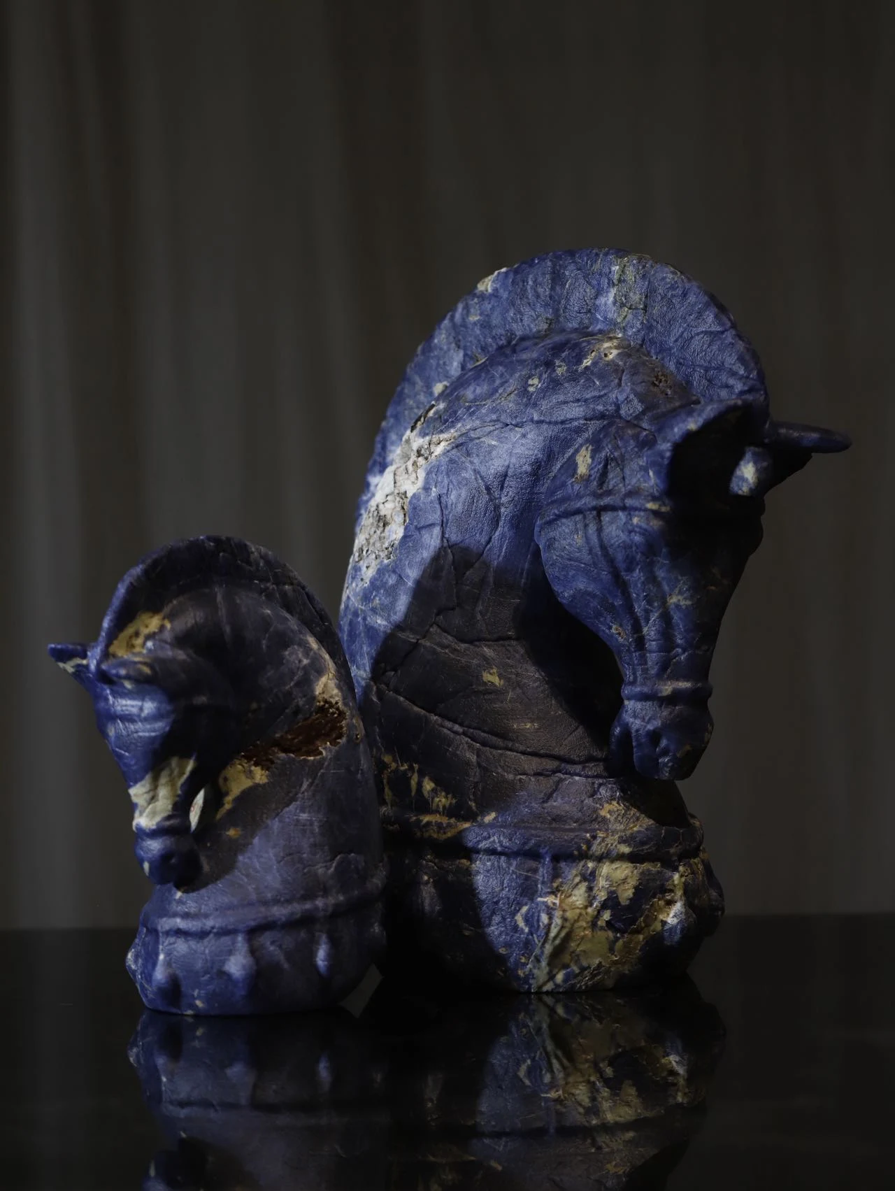 Blue stone horse sculptures
